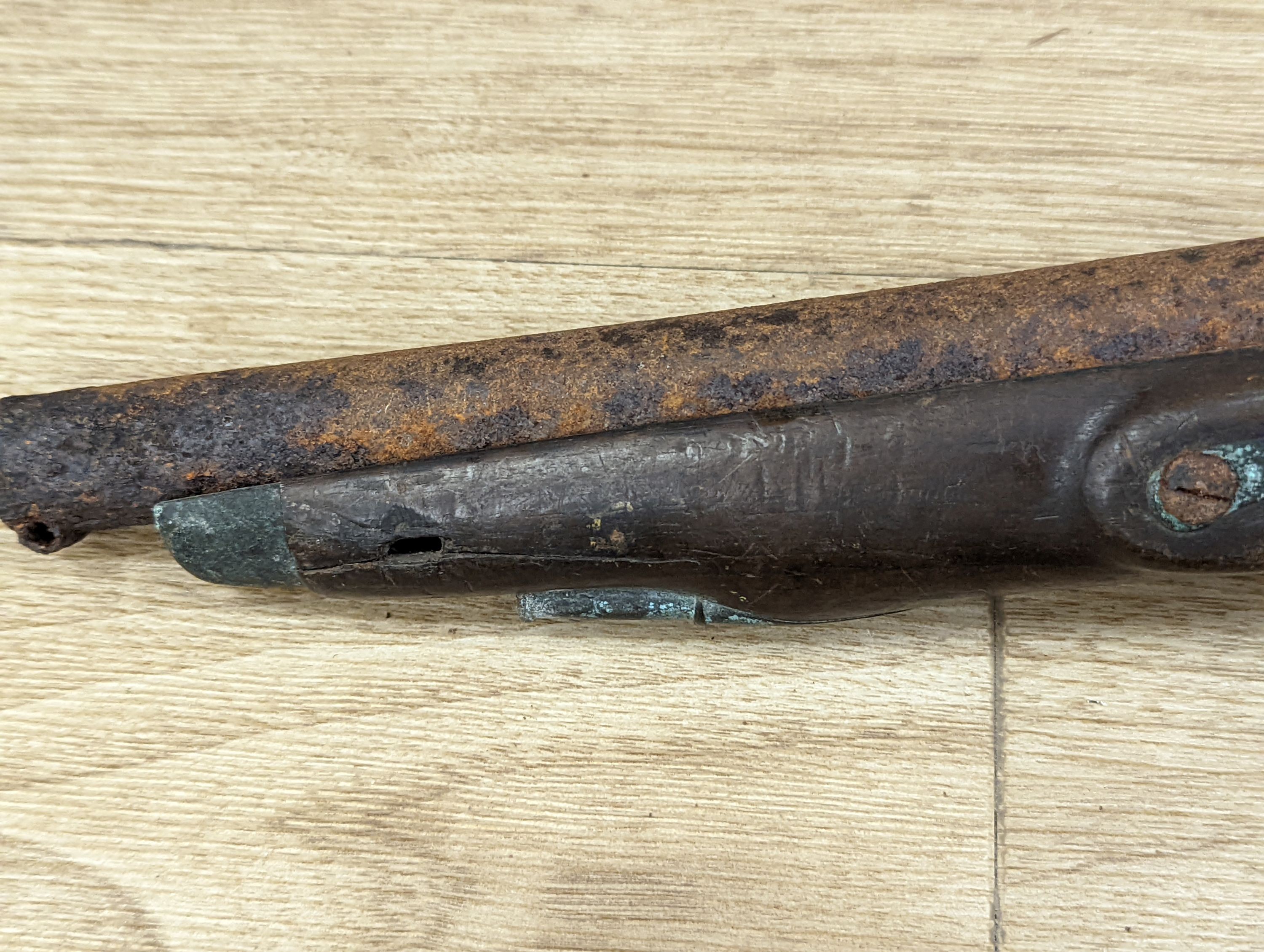 Two 19th century flintlock pistols and a pocket pistol, largest 40 cms long.